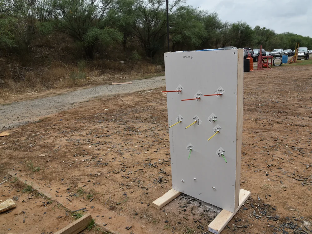 Rods set through holes in a test panel outdoors