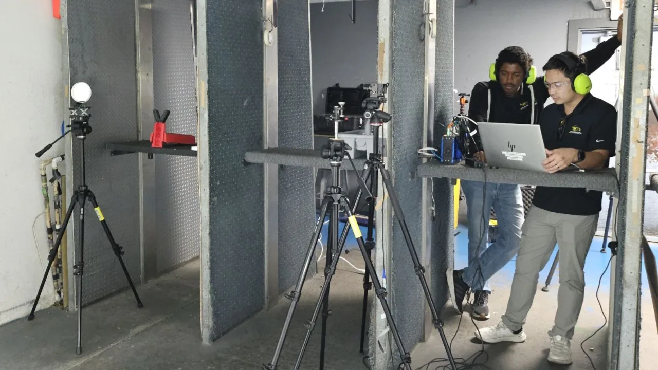 Cameras on tripods positioned around an indoor test area