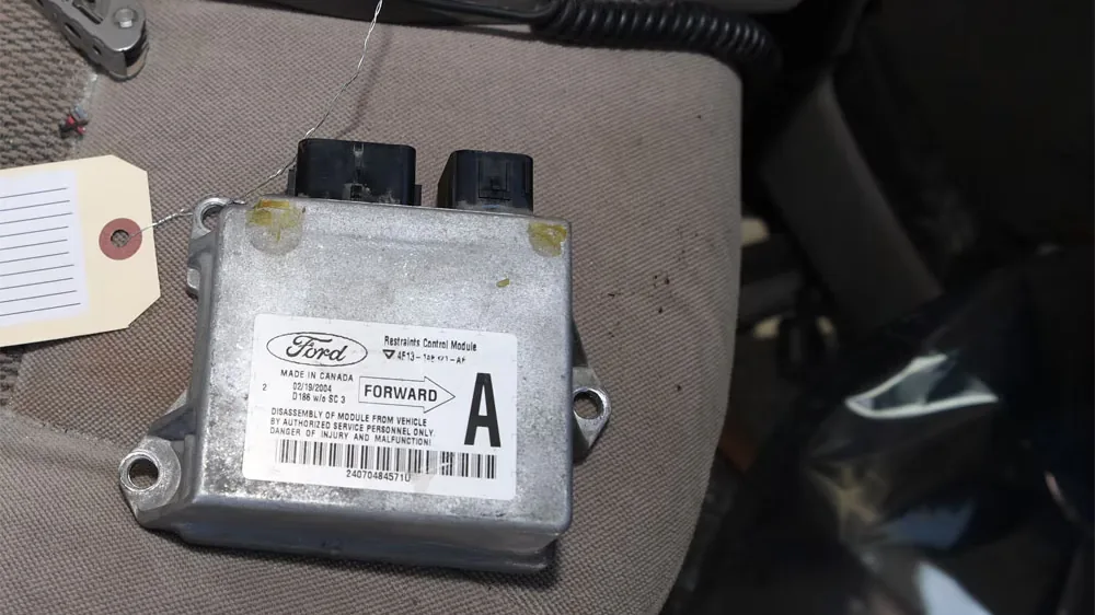 An airbag control module removed from a vehicle