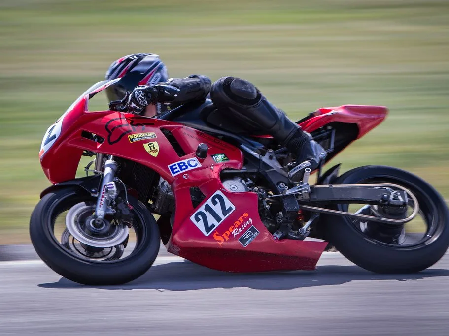 A racing motorcycle leaned over at speed