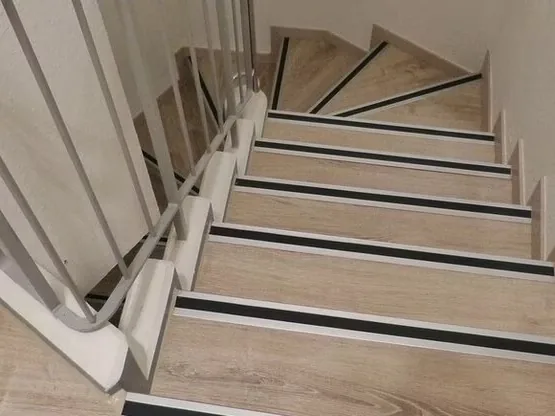 An interior stairway with a handrail
